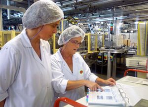 Bel employees working together in facility